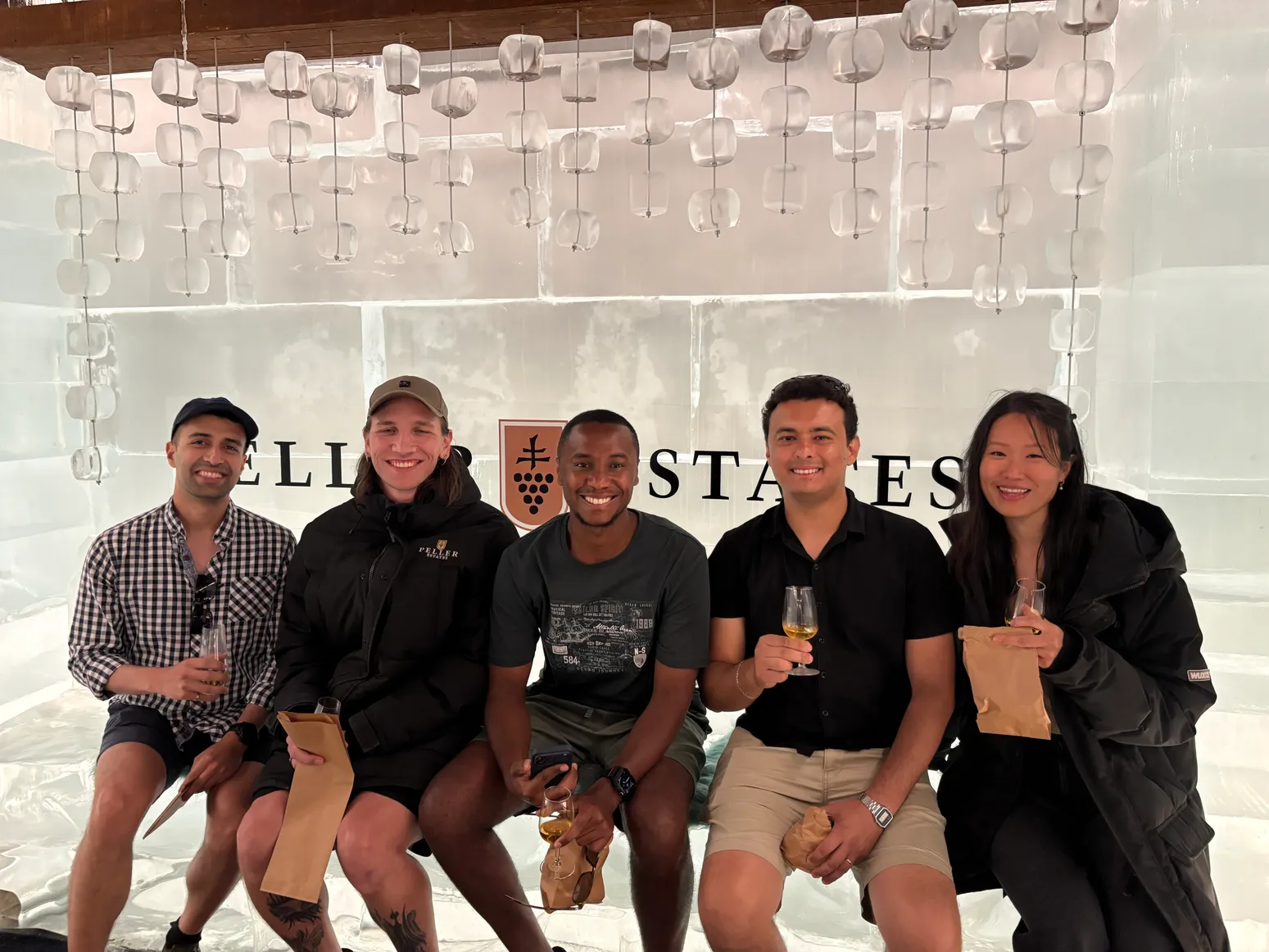 The team at an ice bar wine tasting