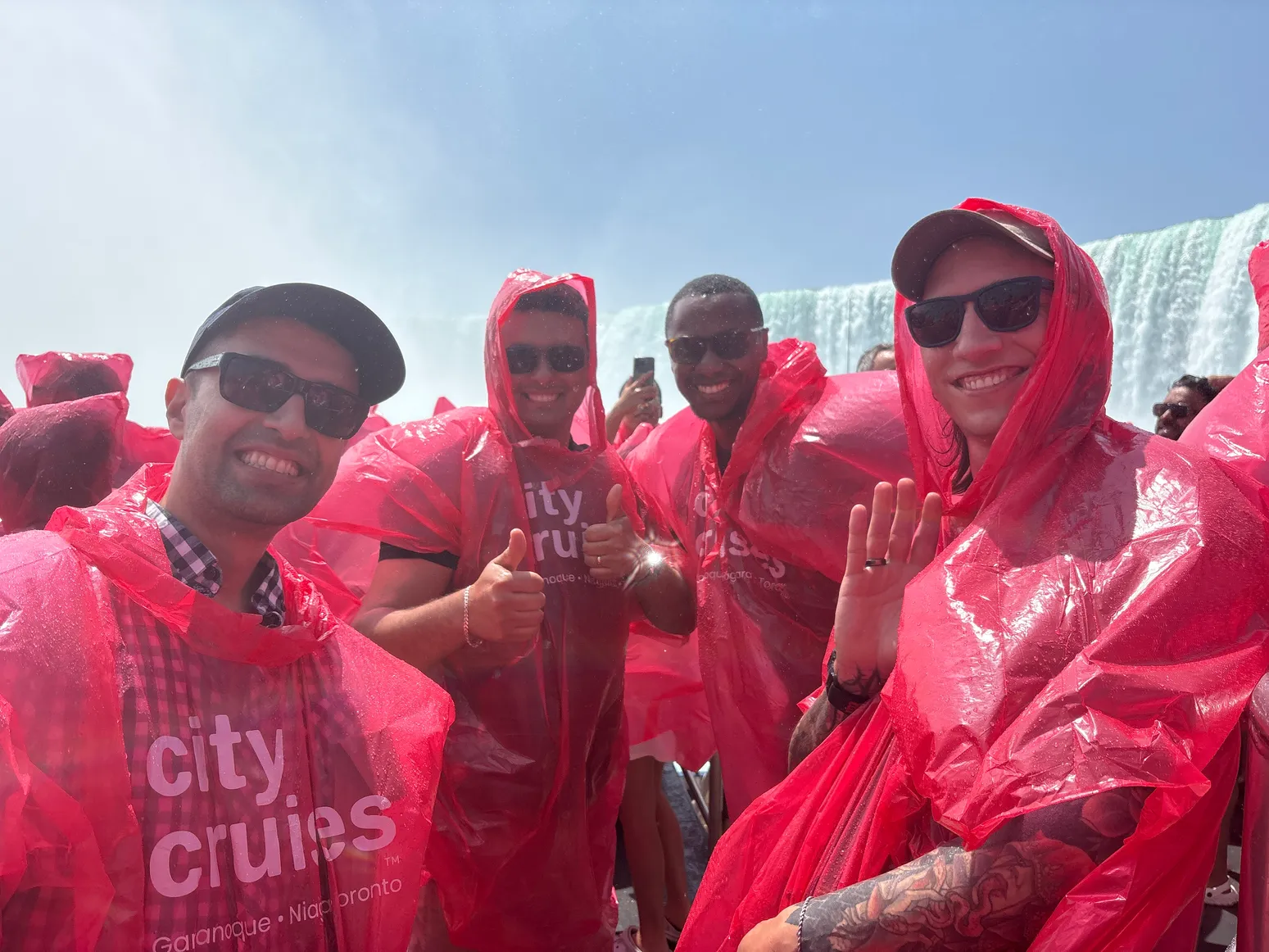 The team in red ponchos on a boat tour at Niagara Falls